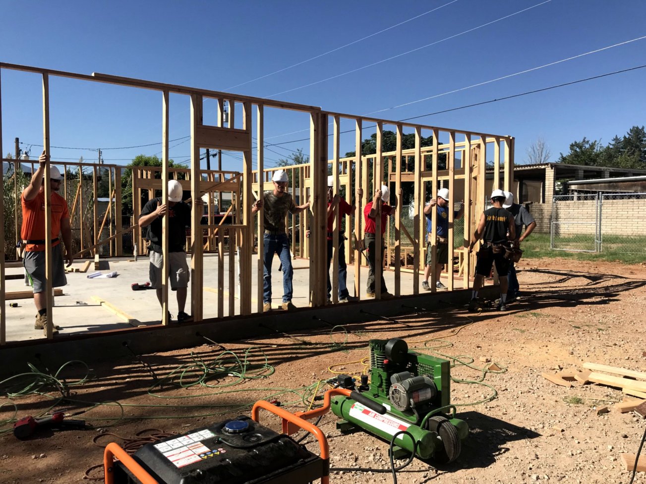 students framing a house