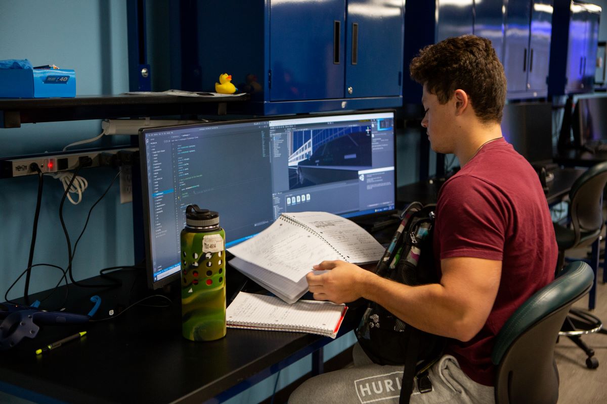 student looking at notes