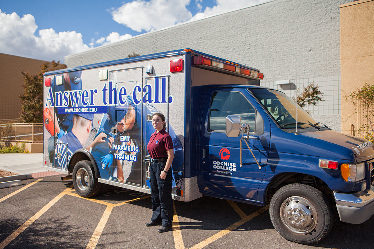 female student in front of an ambulance