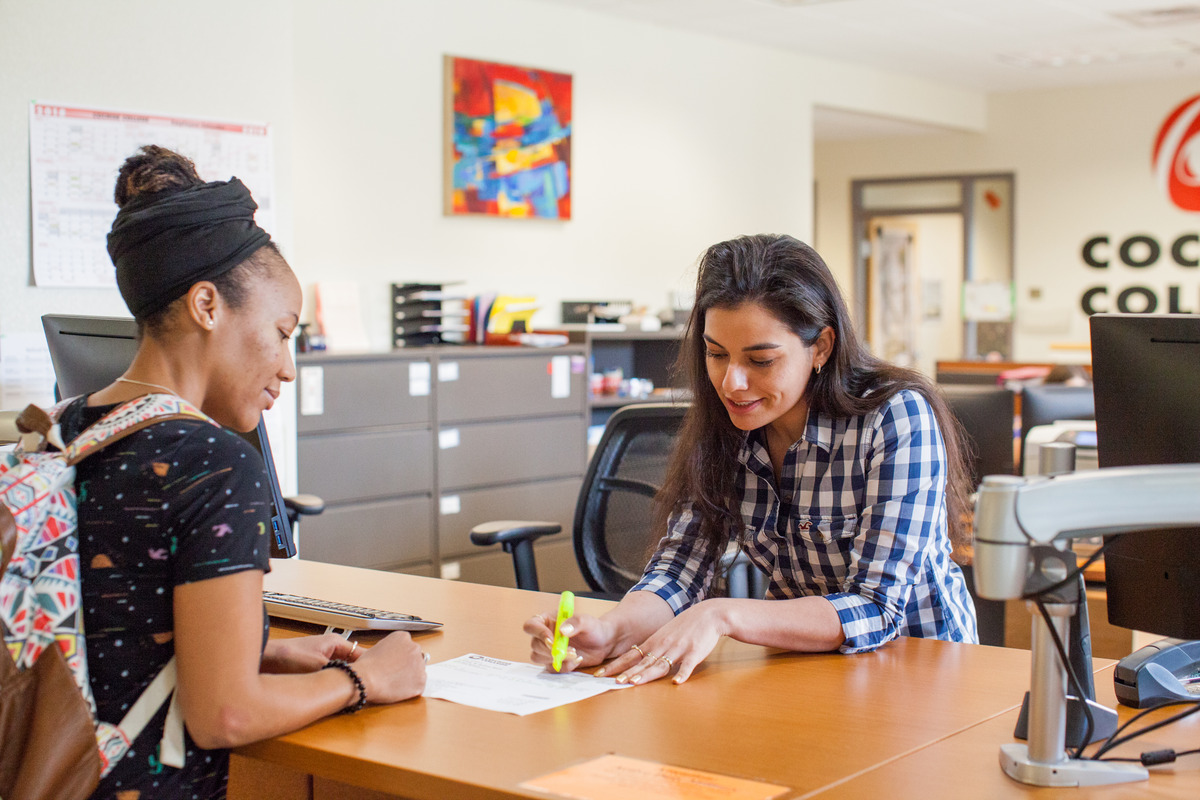 Student worker assisting another student